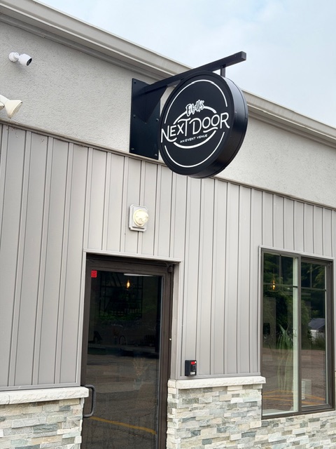 Next Door event venue entrance and exterior sign